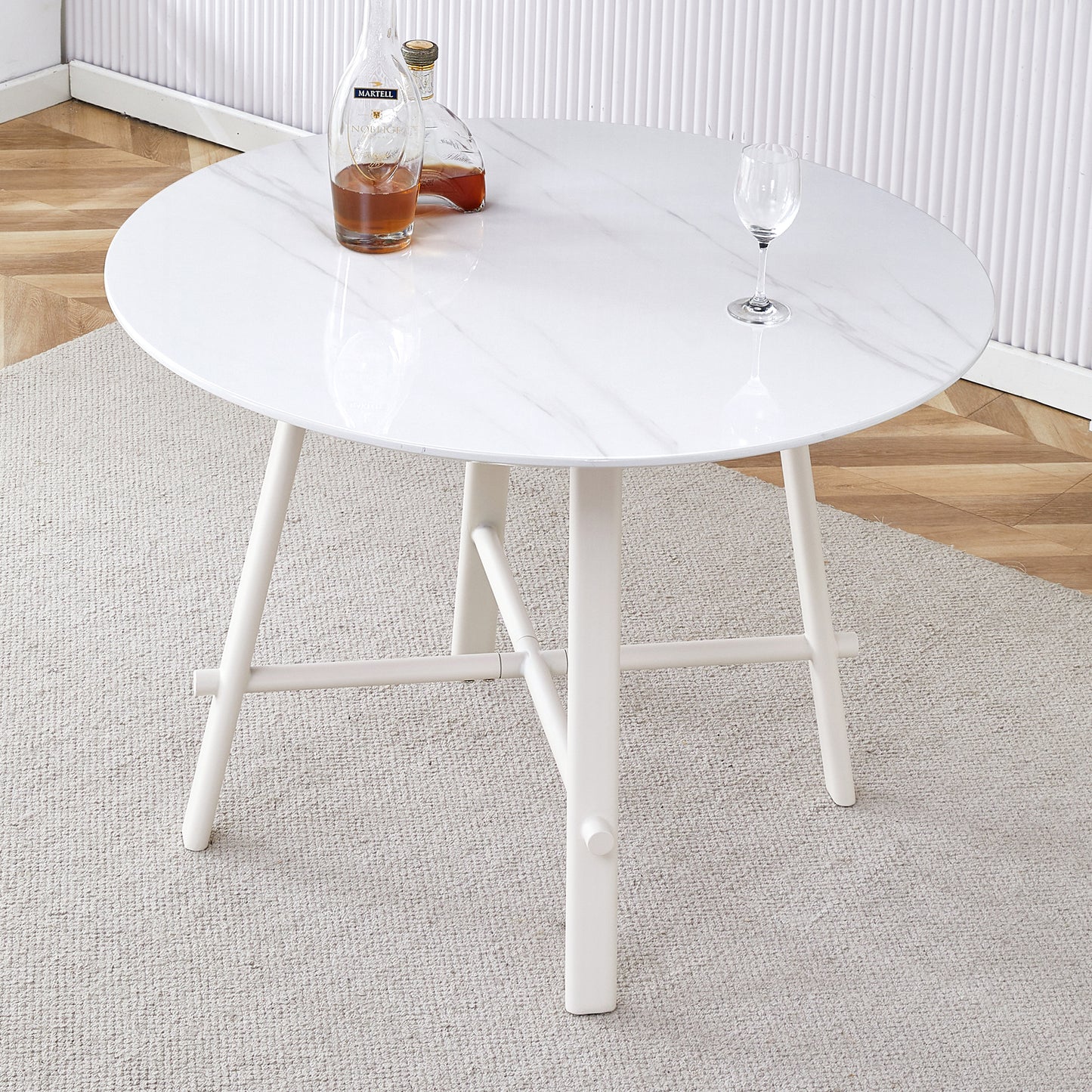 A modern minimalist circular dining table with a 42 inch diameter white patterned tabletop and white metal legs. Suitable for restaurants, living rooms, and conference rooms.W1151P152778 SolidRoot Buy Furniture USA